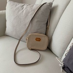 Micheal Kors small bag and hangs at hip